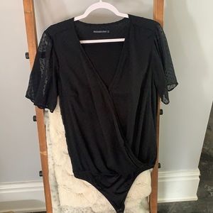 Black polka dot bodysuit